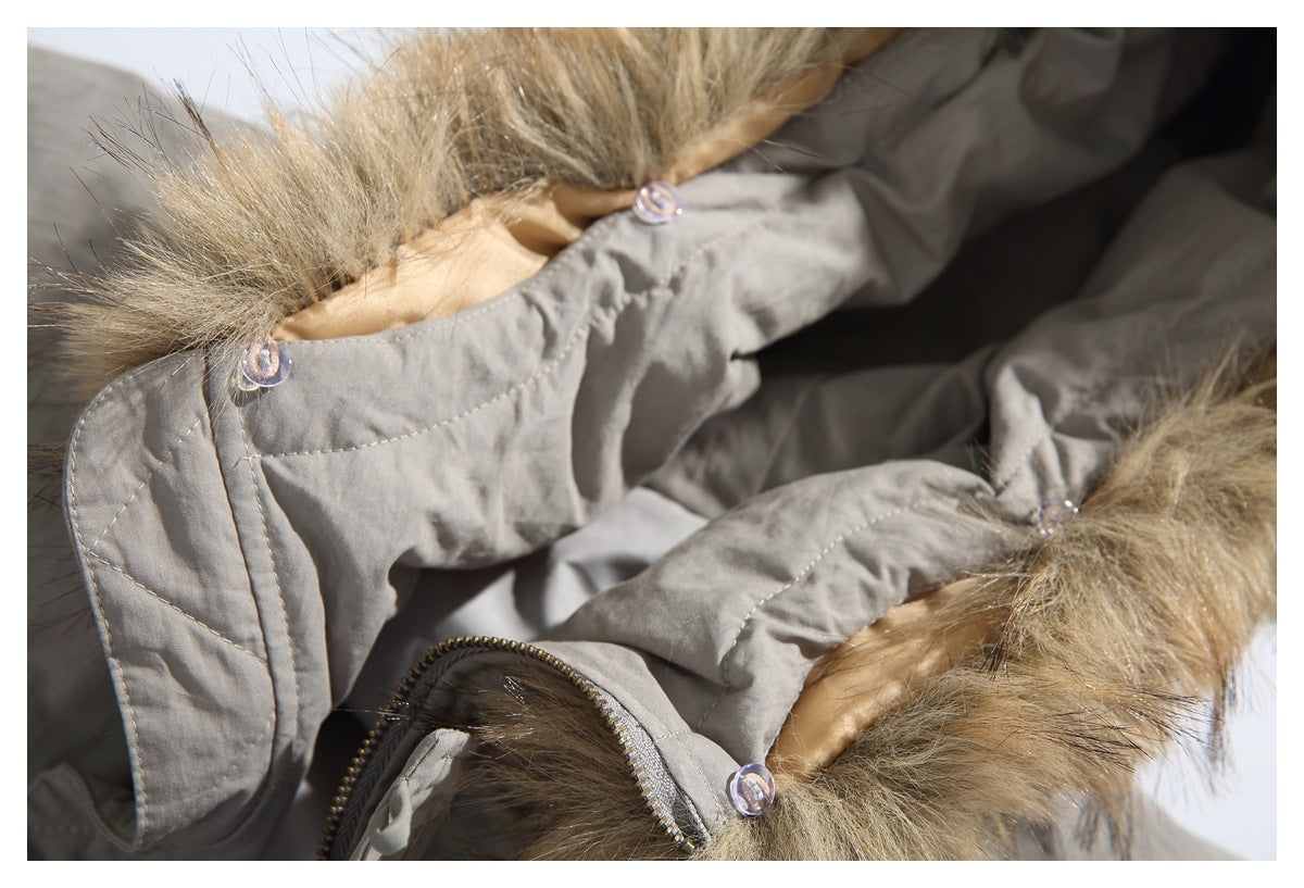 Close-up of the gray jacket's open fur-trimmed hood and stitched inner panels.