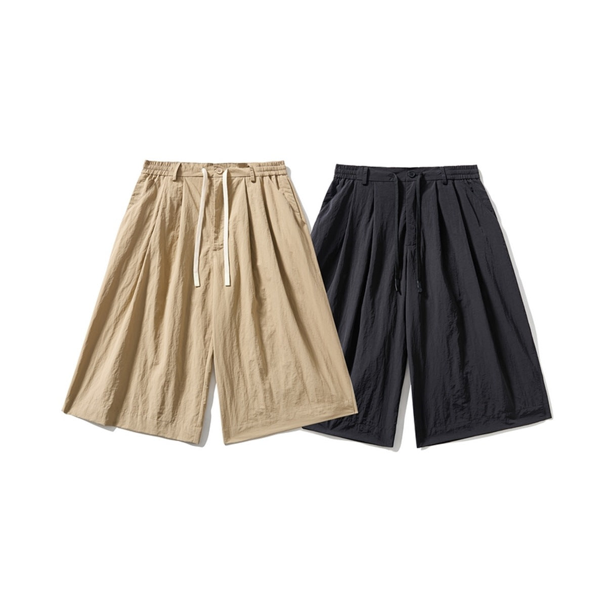 Front view of wide-leg shorts in beige and black, with elasticated waistbands, drawstrings, pleats and side pockets.