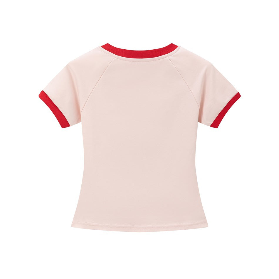 Back view of a pale pink short-sleeve shirt with red neckline and sleeve trim.