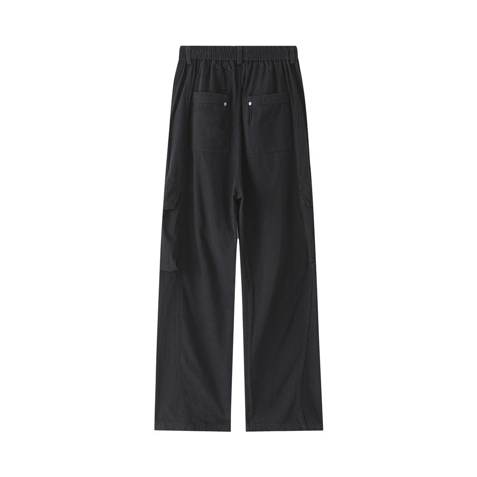 Back view of black wide-leg cargo trousers with an elastic waistband and two rear pockets.