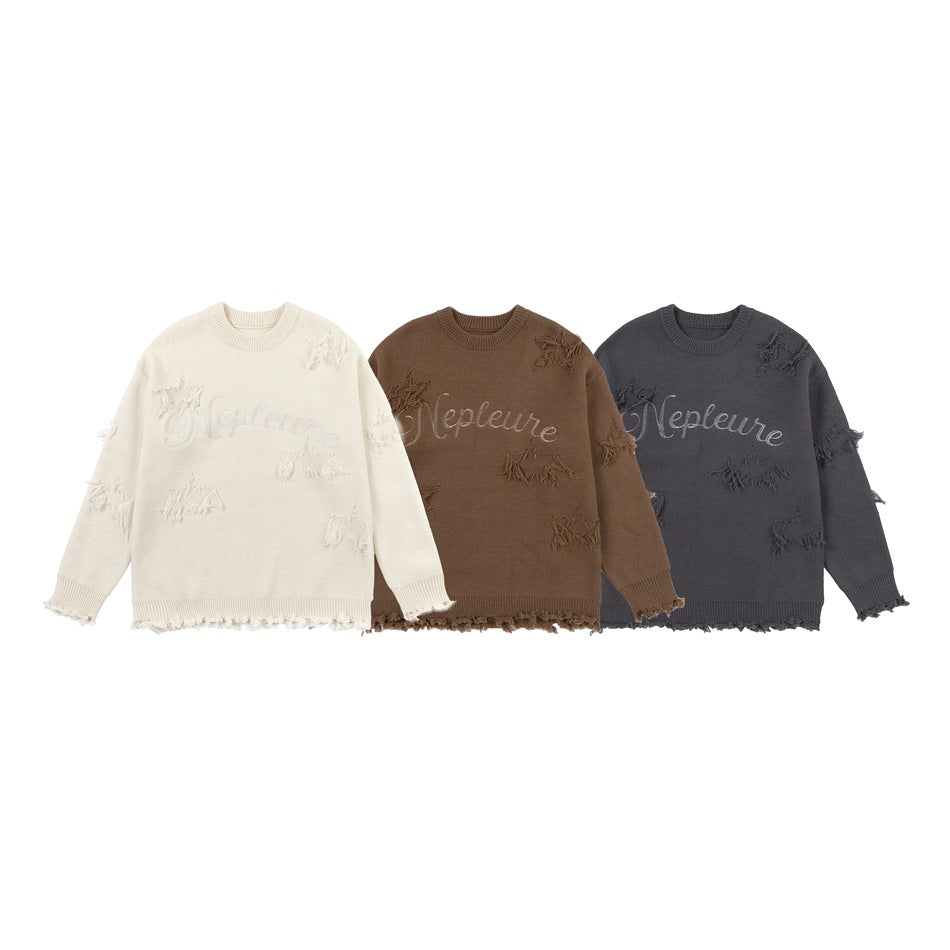 Three sweaters displayed together in cream, brown, and charcoal, with distressed details and script lettering.