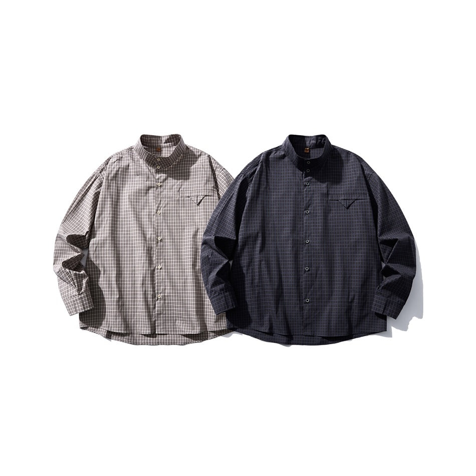 Two checked button-up shirts shown from the front, one gray and cream and one dark navy.