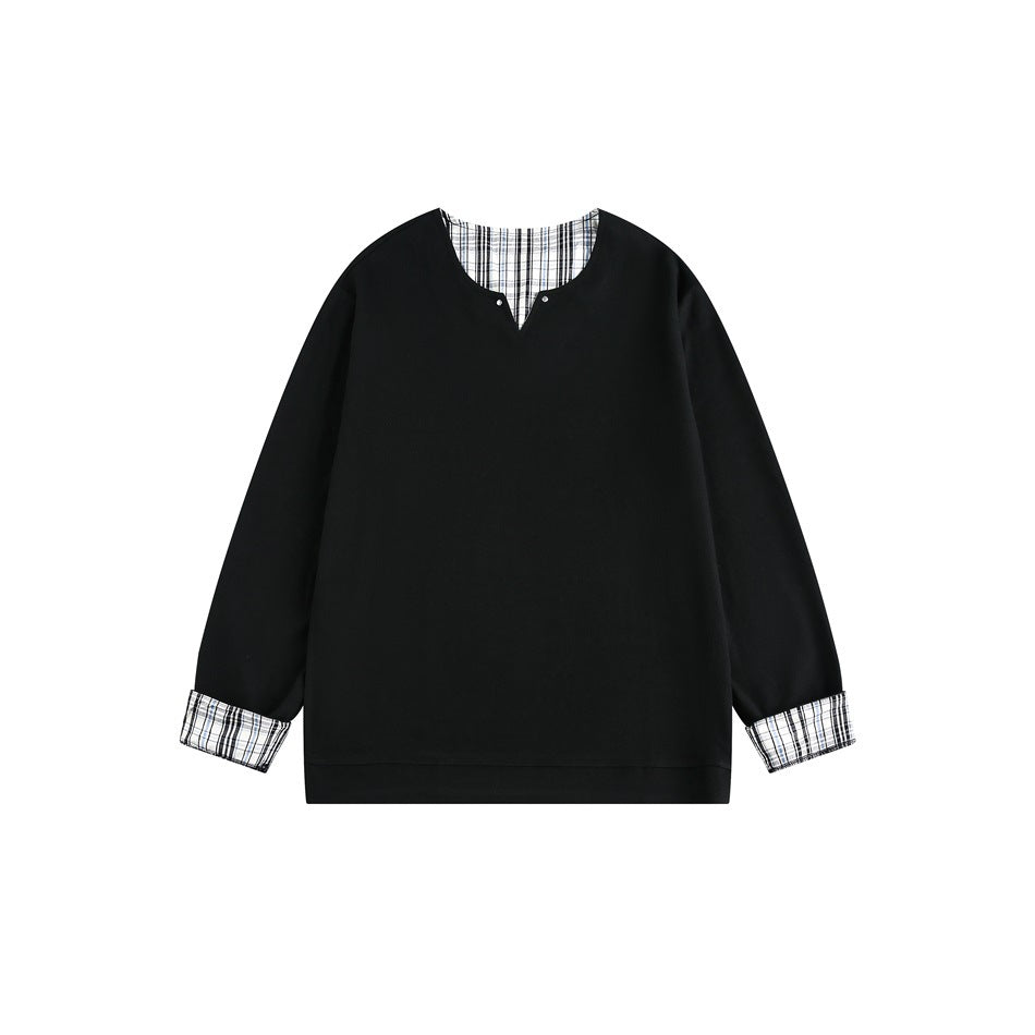 Front view of a black long-sleeve sweatshirt with a plaid-lined split neckline and plaid turned-back cuffs.