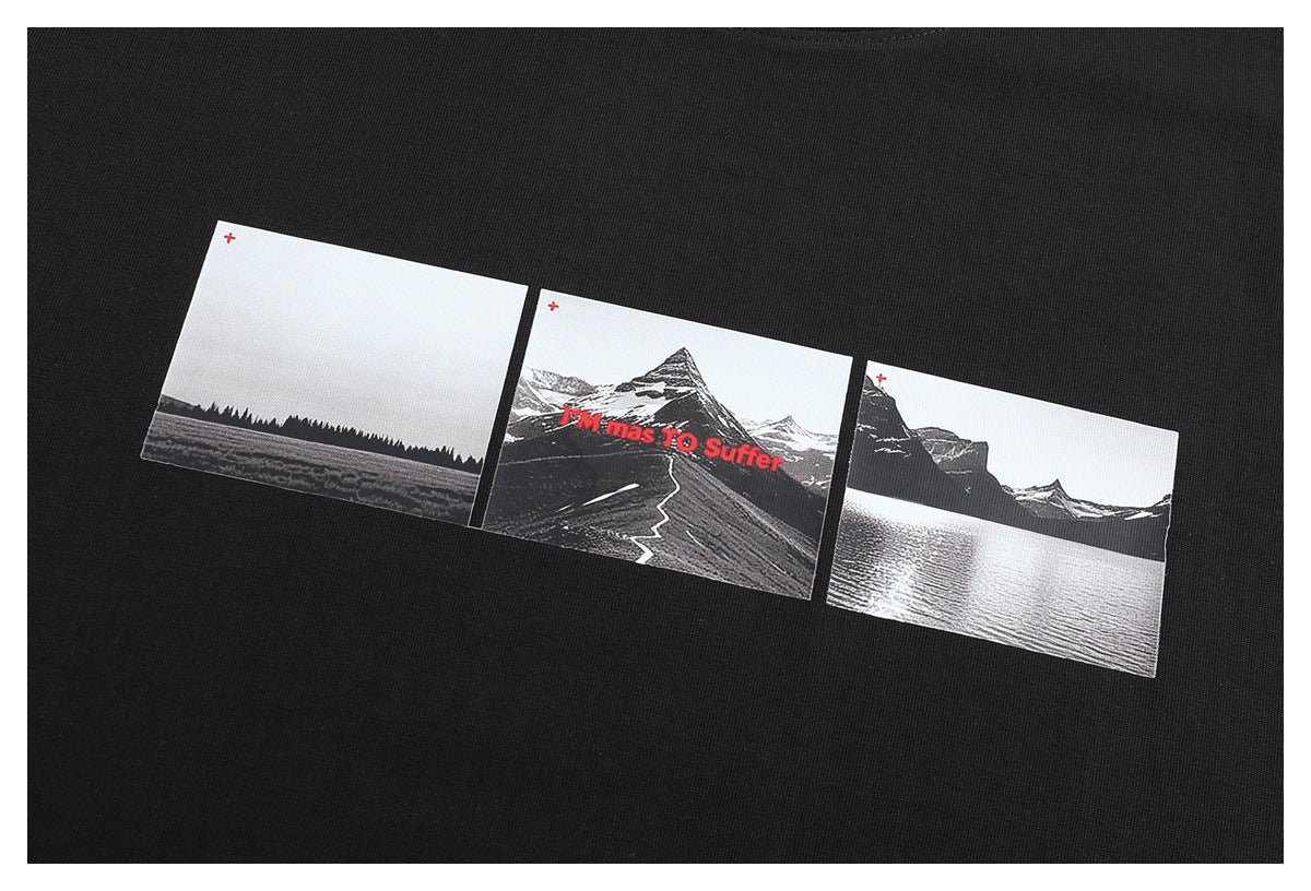 Close-up of a black T-shirt graphic with three monochrome landscape panels and red lettering.