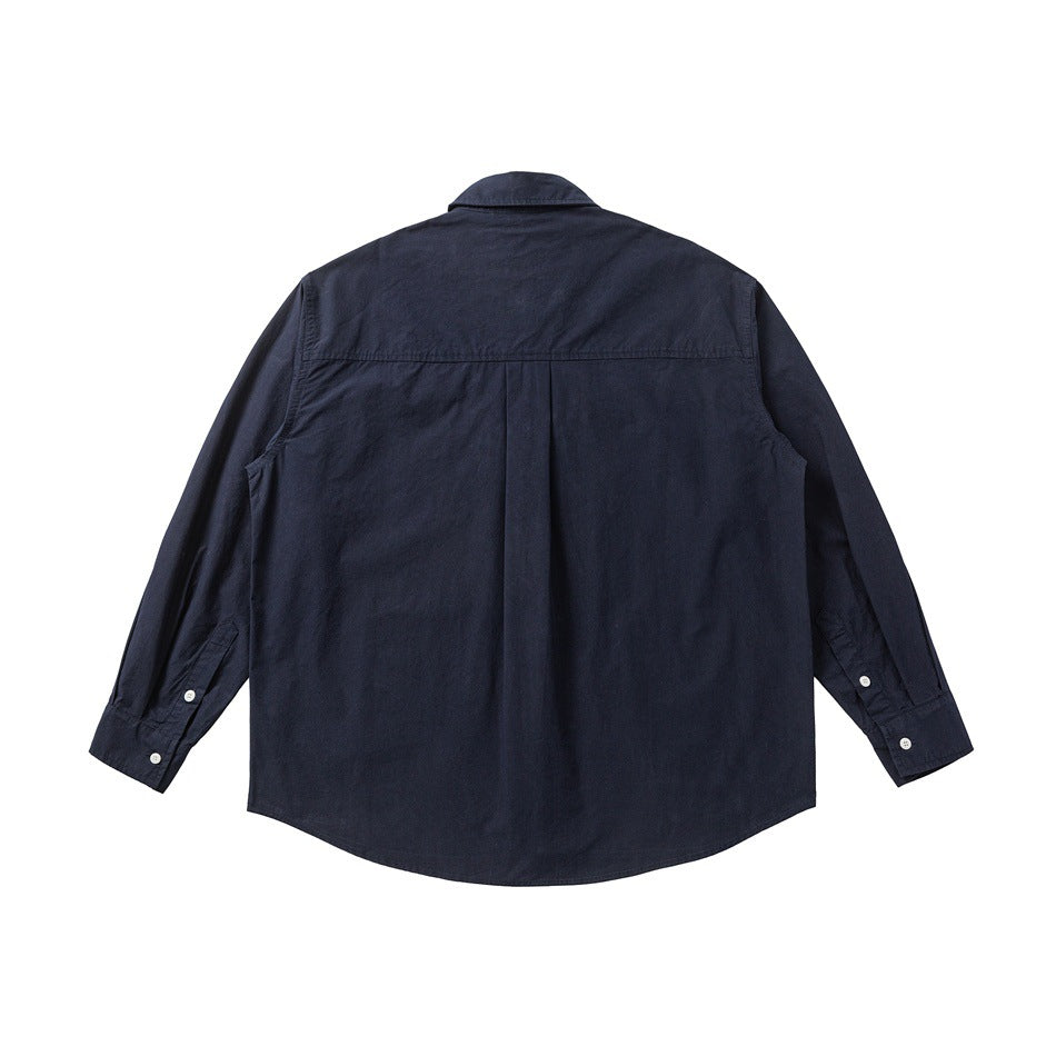 Back view of a dark navy long-sleeve button-up shirt with a center pleat and buttoned cuffs.