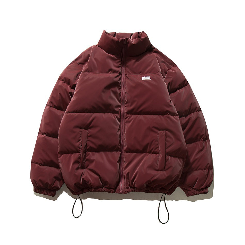 Wine red quilted puffer jacket front with stand collar, zipper, slanted pockets and drawcord hem, shown flat