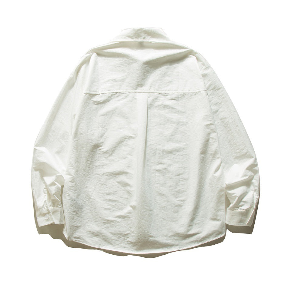 White long-sleeve shirt back view with yoke seam and center pleat, flat lay