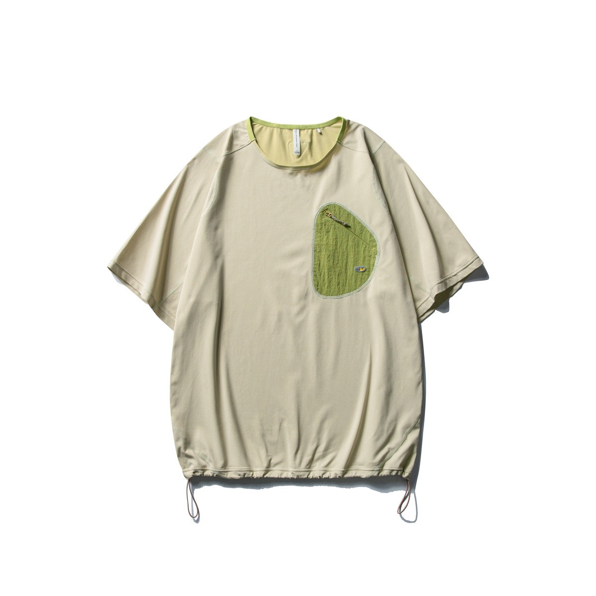 Pale sage green short-sleeve T-shirt with green asymmetric zip chest pocket and drawcord hem