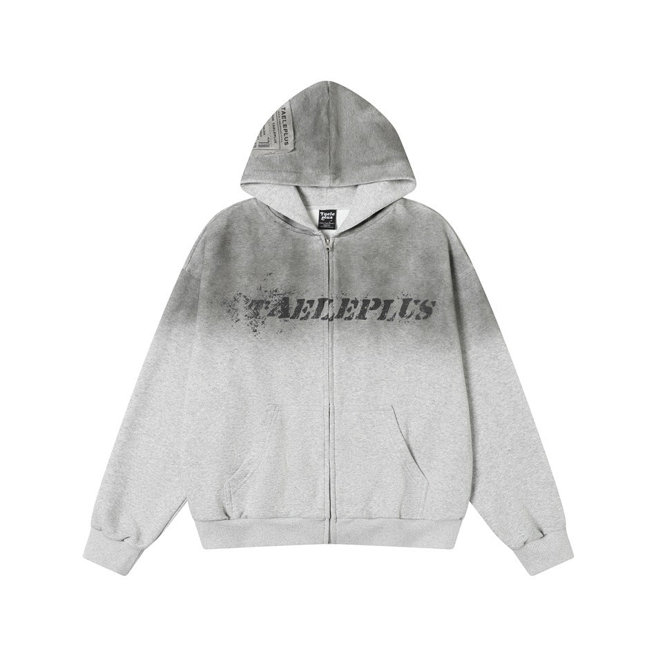 Heather gray zip-up hoodie with dark gradient fade, distressed chest lettering print, front pockets and ribbed cuffs