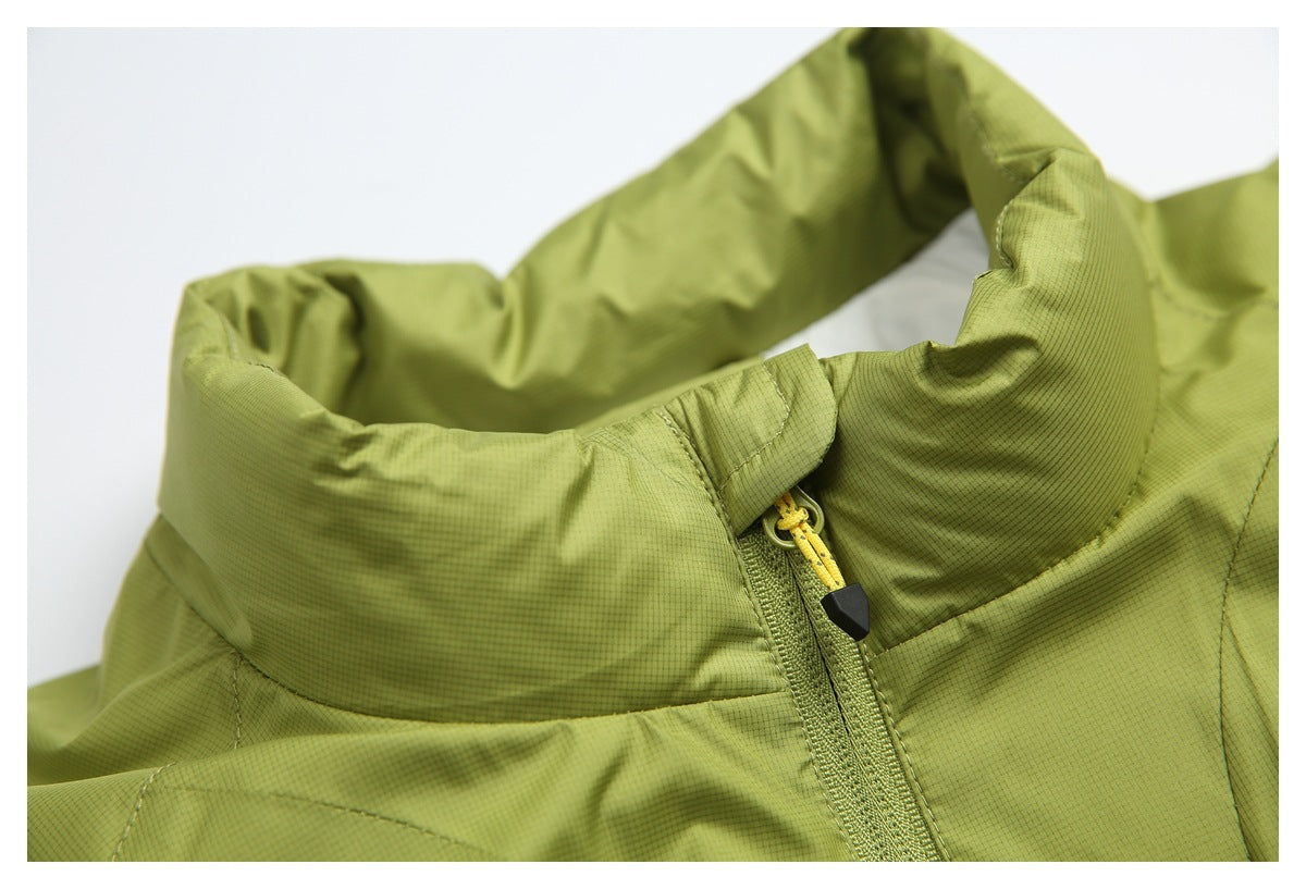 Close-up of an olive-green jacket collar and front zipper with a yellow cord pull.