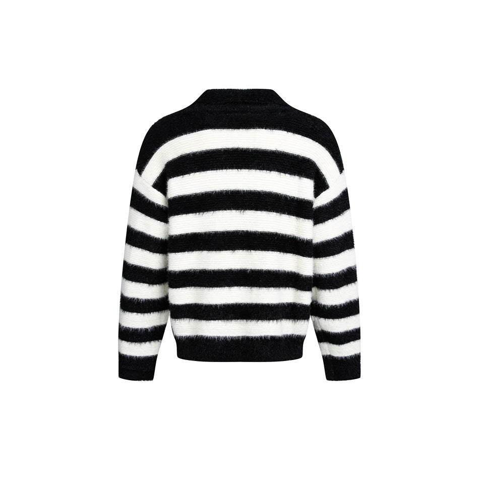 Back view of a black-and-ivory horizontally striped fuzzy knit sweater with long sleeves and a short stand collar.
