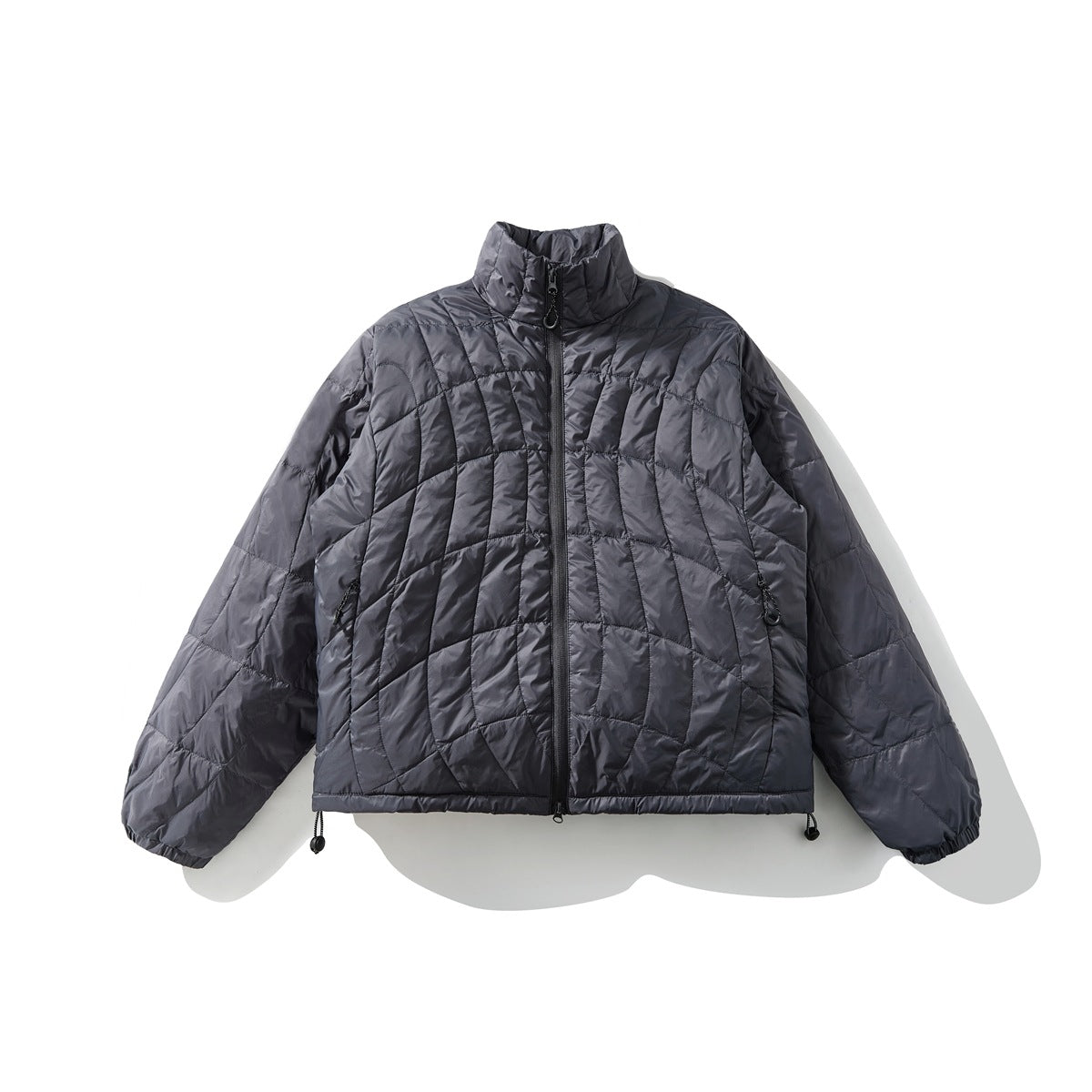 Dark gray quilted stand-collar zip jacket laid flat, front view, with curved grid quilting and drawcord hem