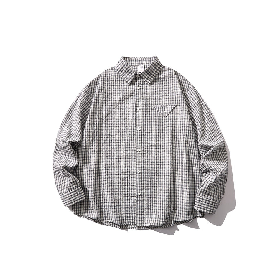 Gray and white small-check long-sleeve button-up shirt with triangular chest pocket, laid flat, front view