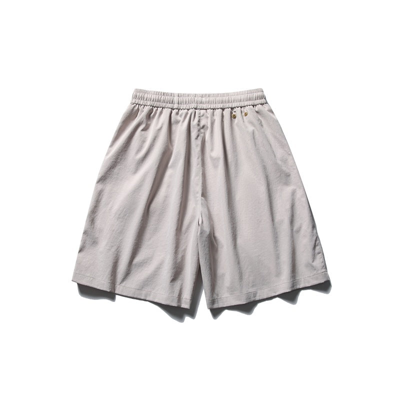 Light gray shorts with an elastic waistband and two small metal eyelets near the waist.