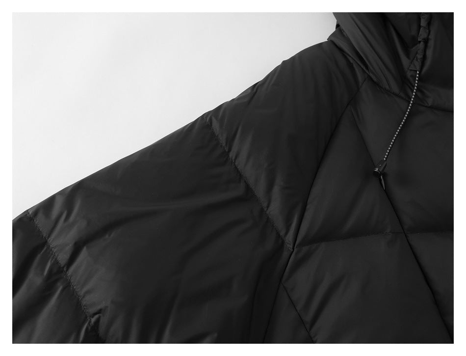 Close-up of the black quilted jacket sleeve and hood drawcord.
