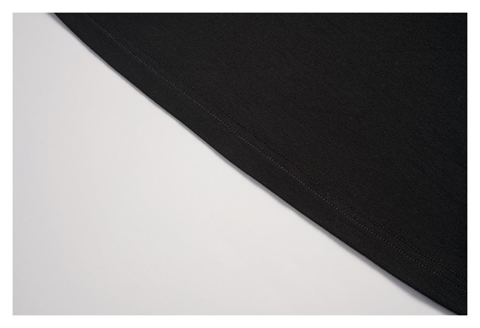 Close-up of the black shirt's double-stitched hem.