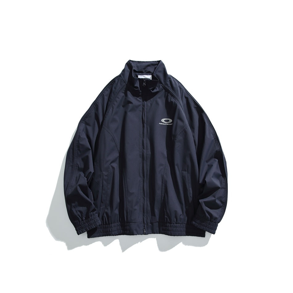 Navy zip-up stand-collar jacket with raglan sleeves, slant pockets and small chest graphic, flat lay