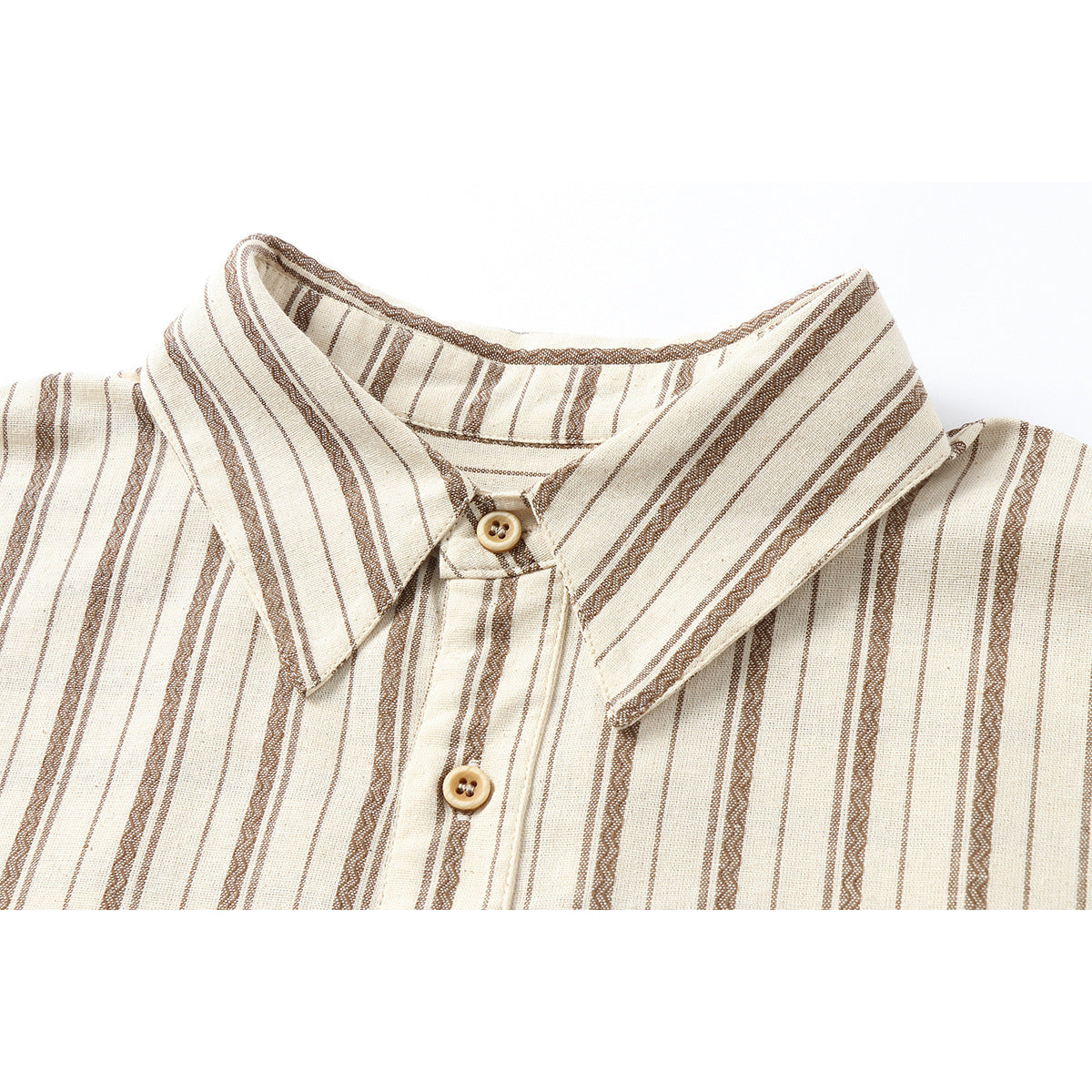 Close-up of a cream shirt collar and button placket with brown vertical stripes.