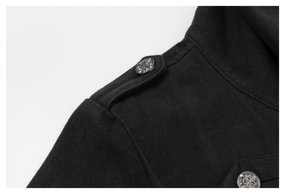 Close-up of a black jacket shoulder tab with a decorative silver button and visible seam detail.