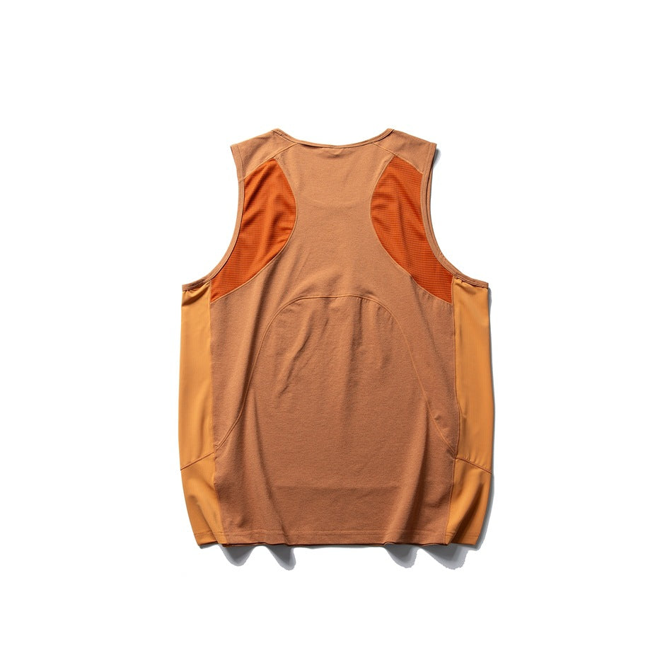 Back view of a rust-brown sleeveless top with contrasting orange mesh panels and curved seam detailing.