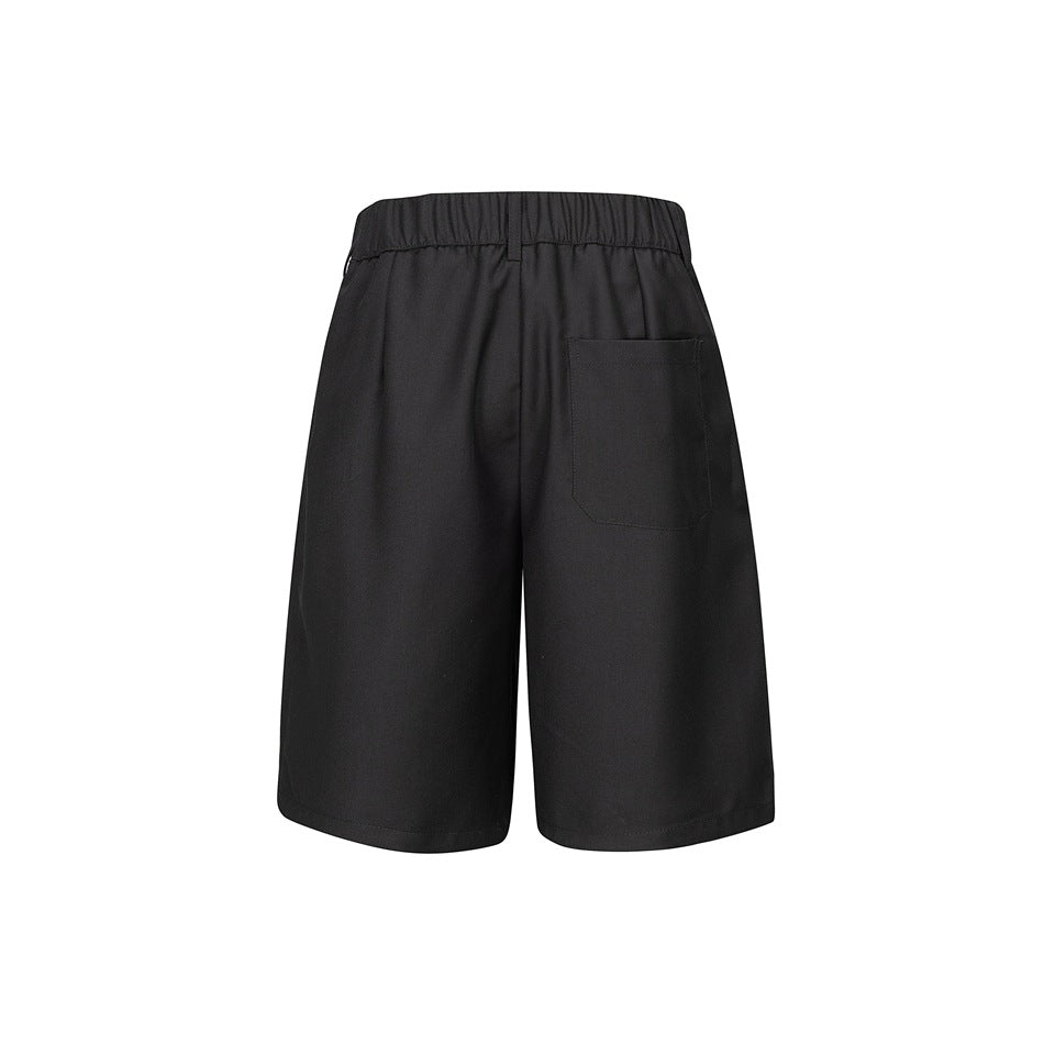 Back view of black shorts with an elastic waistband, belt loop, and single patch pocket.