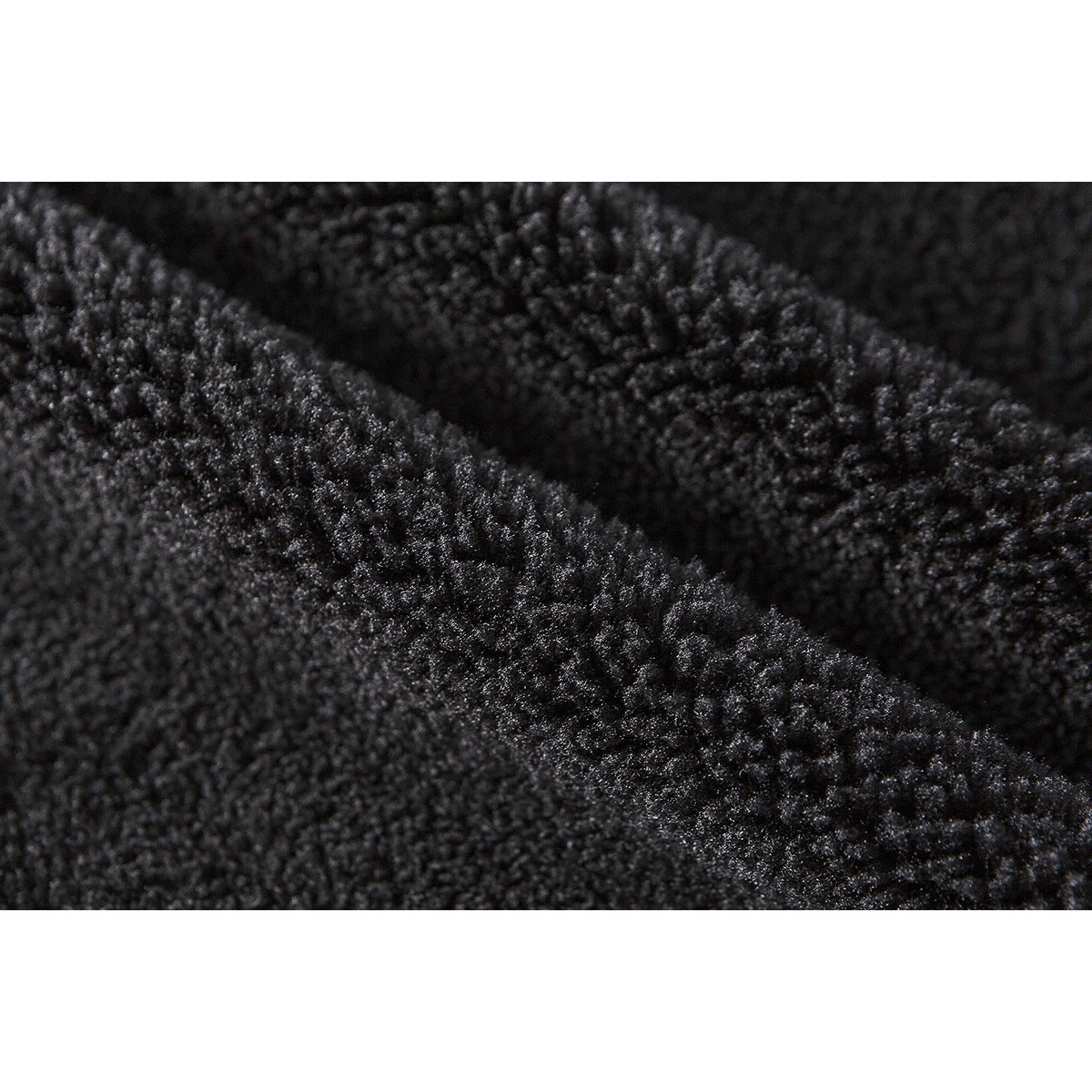 Macro view of the jacket's thick black fleece lining.