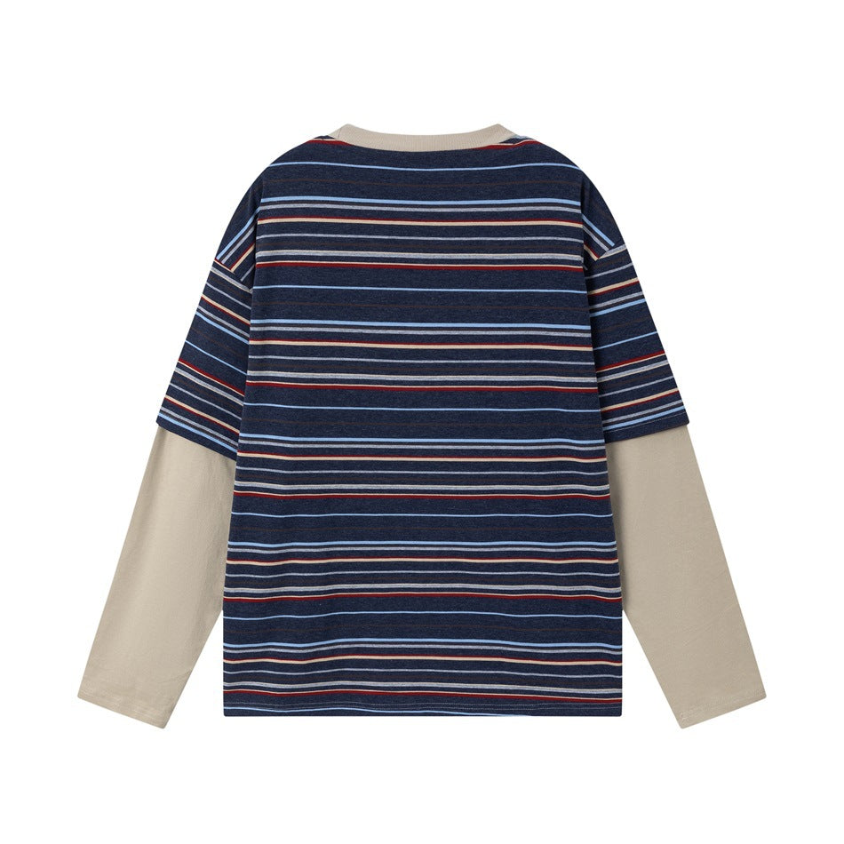 Back view of a navy striped layered shirt with plain beige long sleeves and a beige neckline.