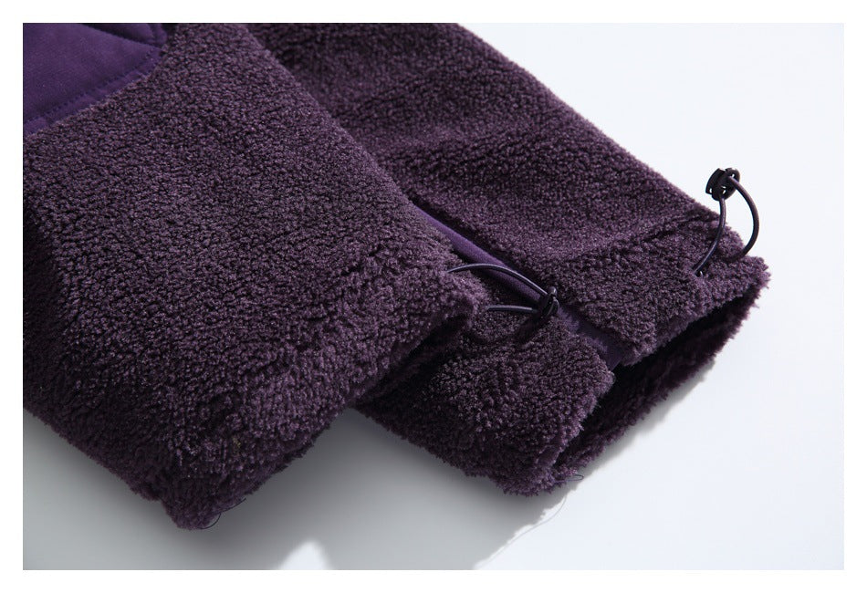 Close-up of deep purple fleece garment edges with black drawcords and cord locks.