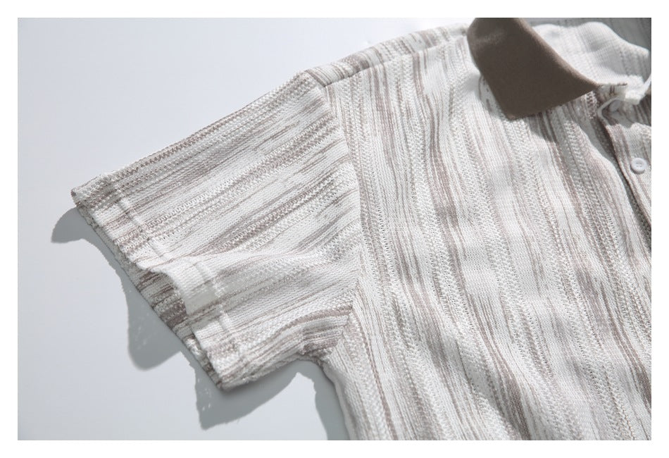 Close-up of the short sleeve and striped openwork knit on an ivory polo shirt with a taupe collar.