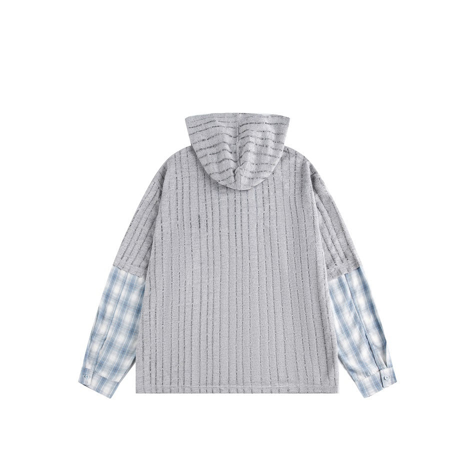 Back view of a gray vertically textured hooded top with blue plaid shirt-style sleeves.