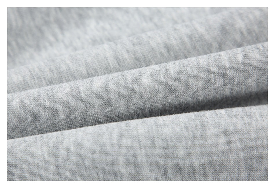 Macro view of the heather gray garment fabric folded to show its knit texture.