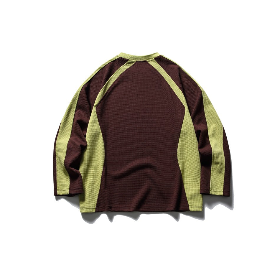 Back view of a burgundy long-sleeve top with lime-green raglan panels.