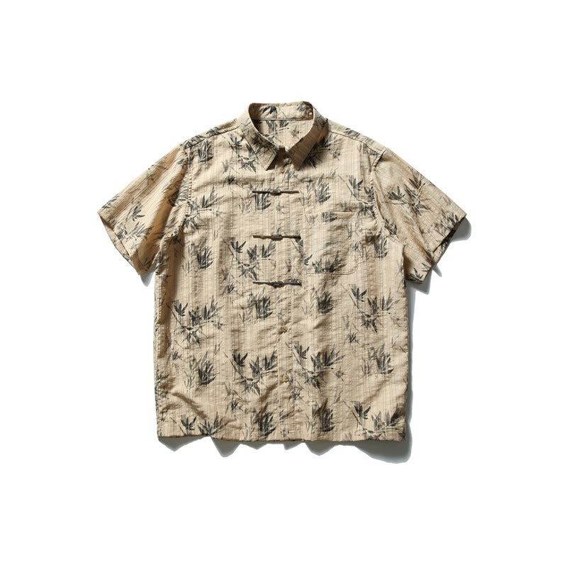 Khaki short-sleeve shirt with gray bamboo leaf print, knot closures and chest pocket, front flat lay