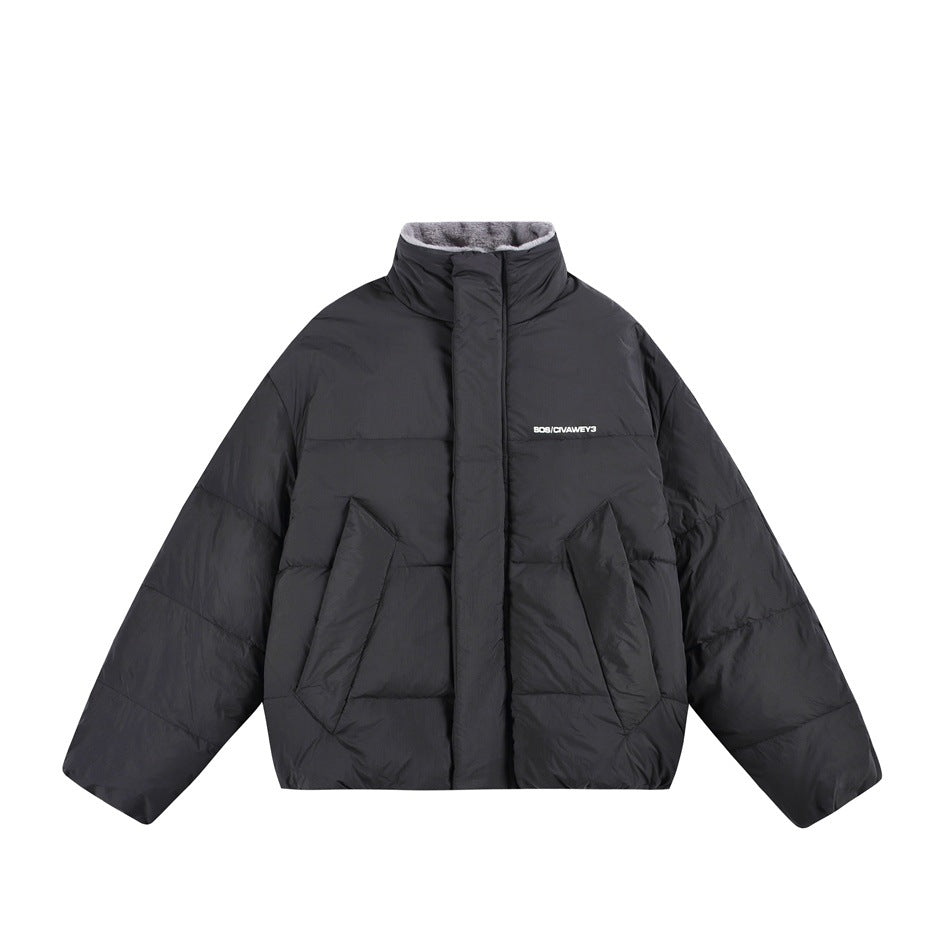 Front view of a black puffer jacket with a high collar, front pockets, and small white chest lettering.