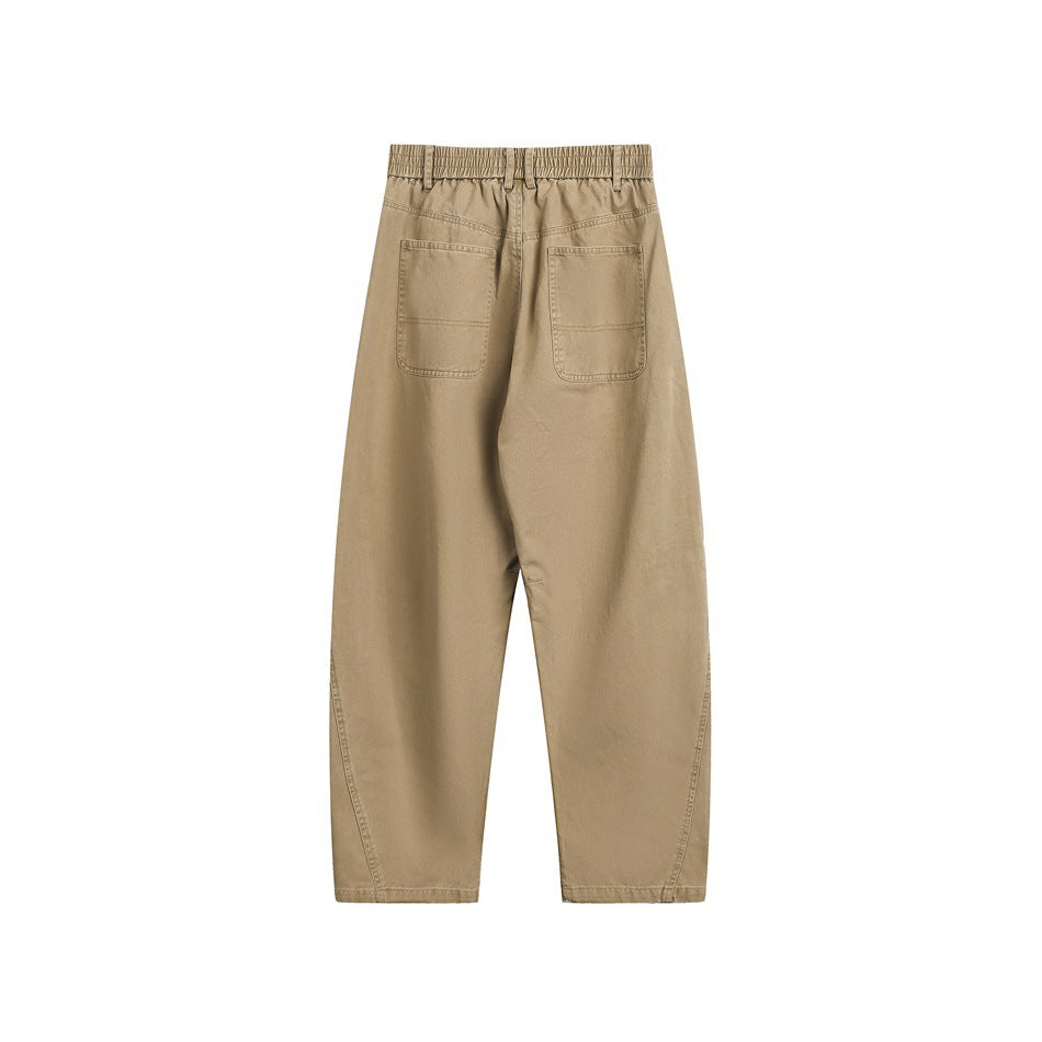 Back view of tan wide-leg trousers with an elastic waistband and two patch pockets.