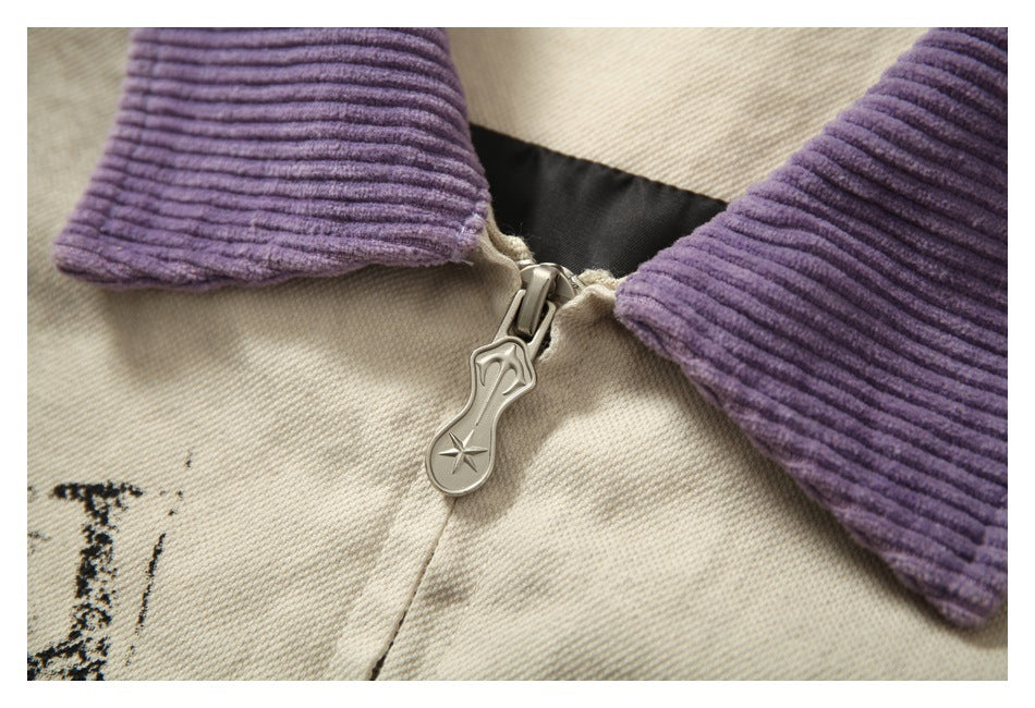 Close-up of the jacket zipper pull with a star motif, framed by the purple collar and cream fabric.