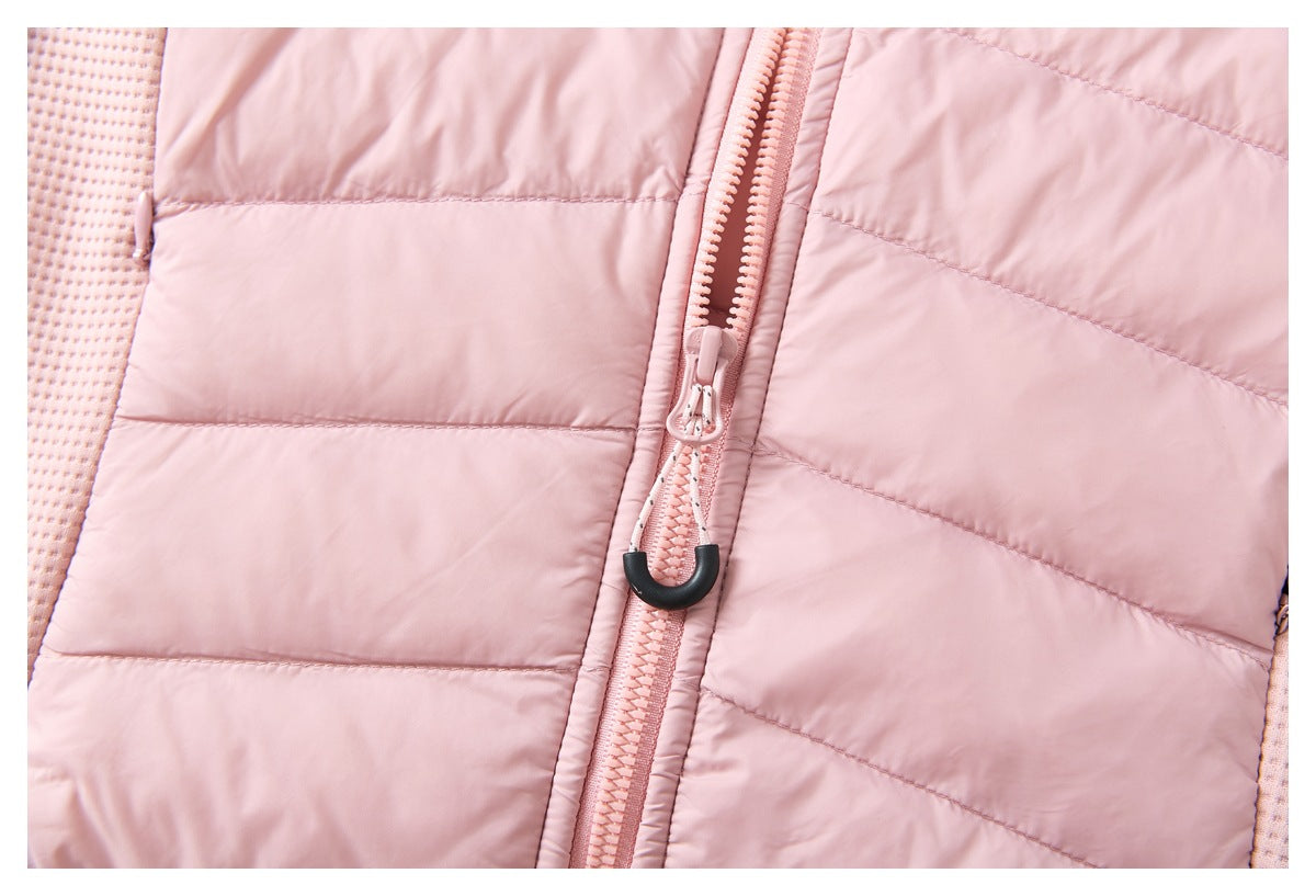 Close-up of the pink jacket's front zipper with a corded pull and black end grip.
