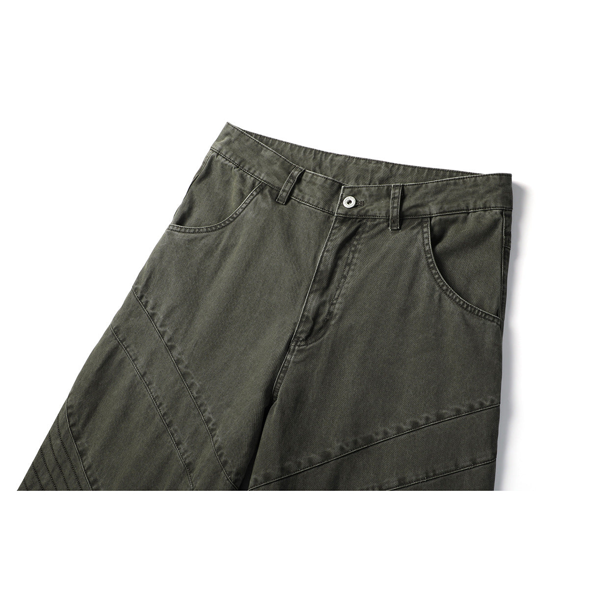 Close-up of olive-gray pants showing the front waistband, button, belt loops, pockets and diagonal panel seams.