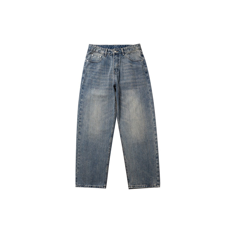 Front view of washed blue straight-leg jeans with faded whiskering, belt loops and front pockets on a white background