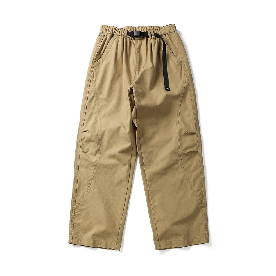 Flat-lay front of khaki wide straight-leg pants with elastic waist, black buckle belt and curved leg seams