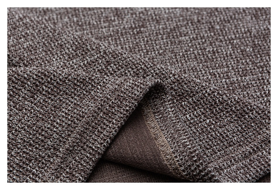 Close-up of the cardigan's knit edge and finished interior seam.