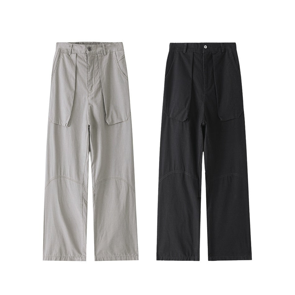 Two pairs of wide-leg trousers shown from the front, in light gray and black, with large pockets and curved knee seams.