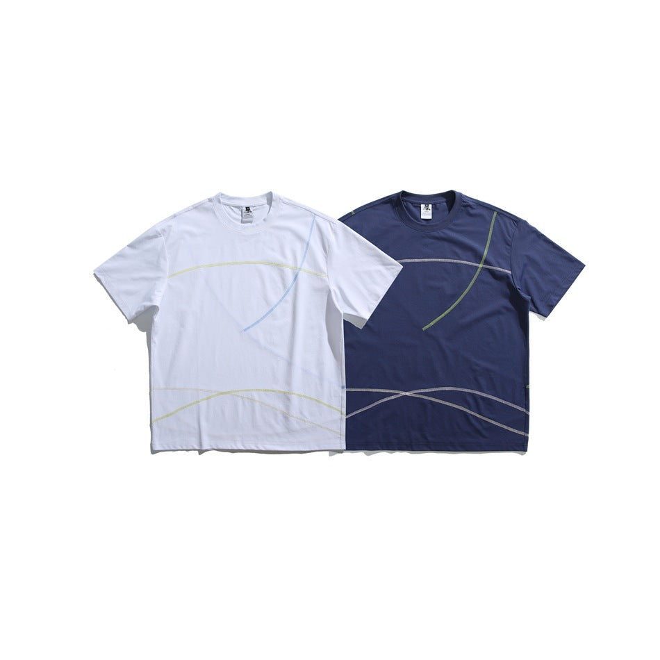 White and navy short-sleeve T-shirts displayed together, each with curved contrast seam details.