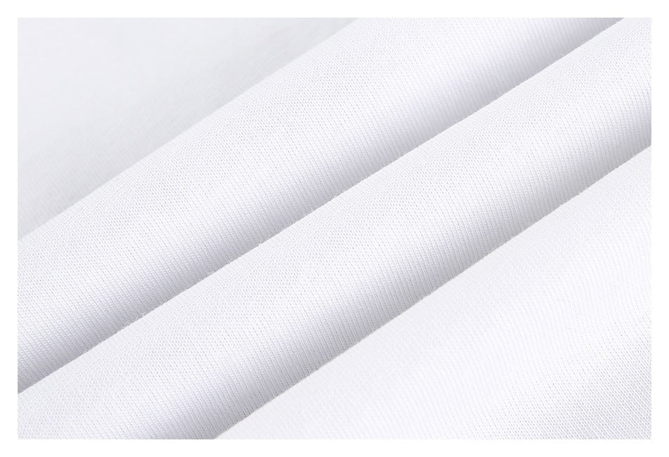 Close-up of white fabric arranged in diagonal folds, showing its fine knit texture.