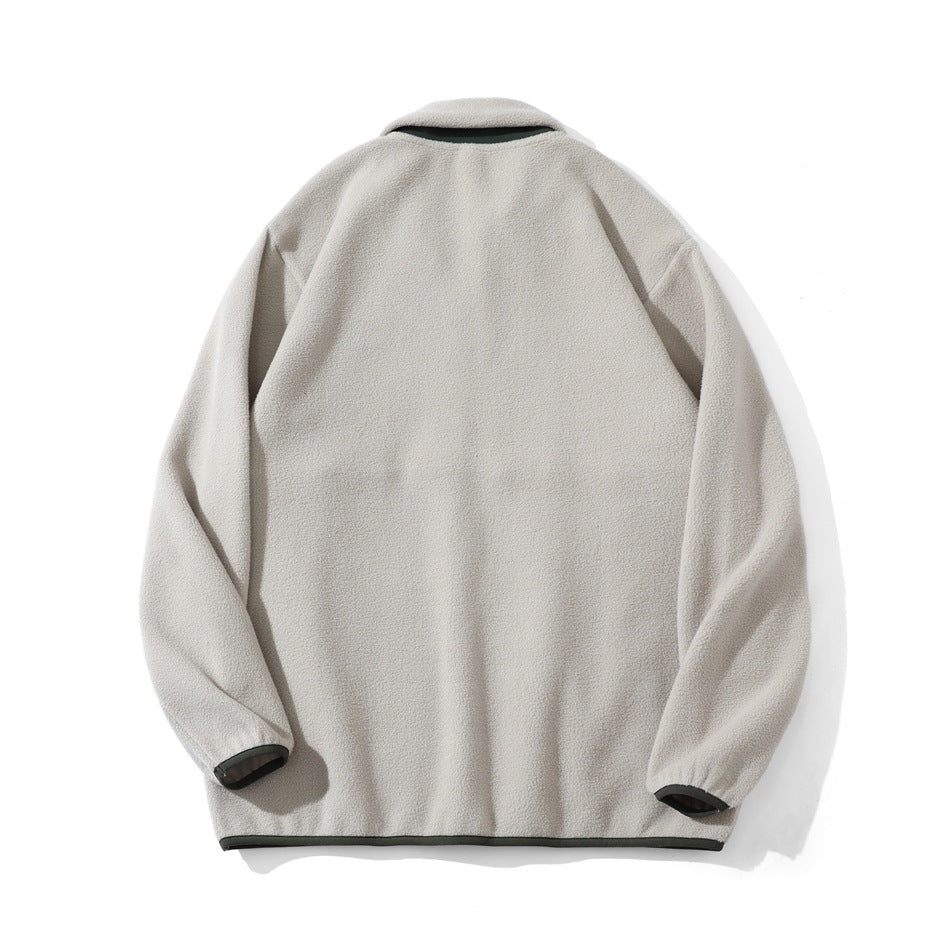 Back view of a cream fleece pullover laid flat, with dark trim at the collar, cuffs and hem.