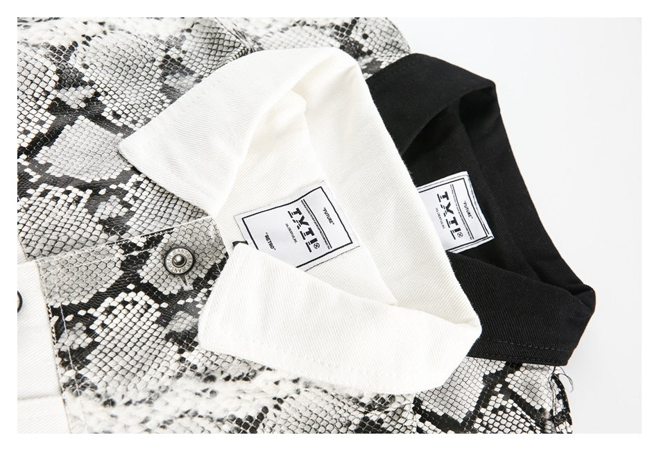 Close-up of white and black jacket collars with snakeskin-print panels and sewn-in labels.