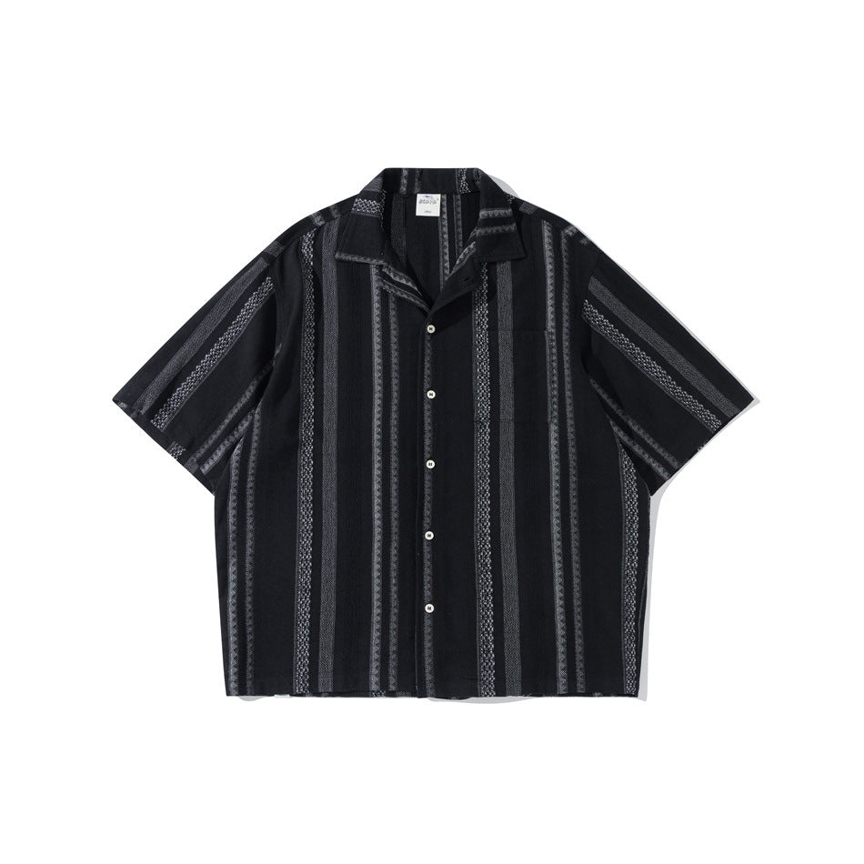 Black short-sleeve camp collar shirt with gray vertical jacquard stripes, button front and chest pocket, flat lay
