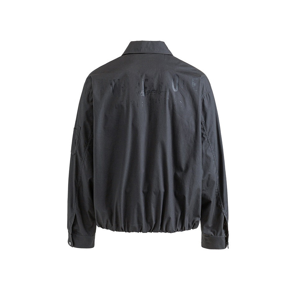 Back view of dark gray jacket with faded tonal graphic print, collar, button cuffs and gathered hem