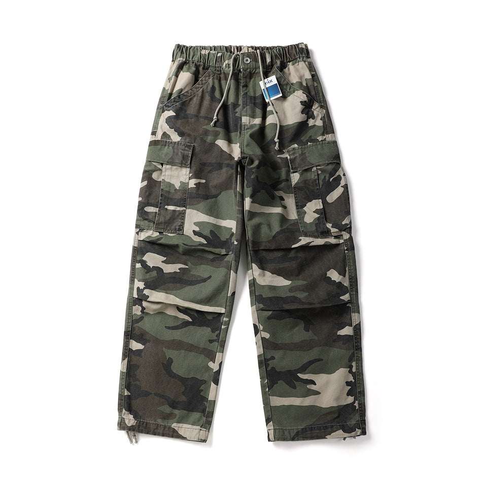 Camouflage wide-leg cargo pants flat lay with elastic drawstring waist, flap thigh pockets and knee pleats