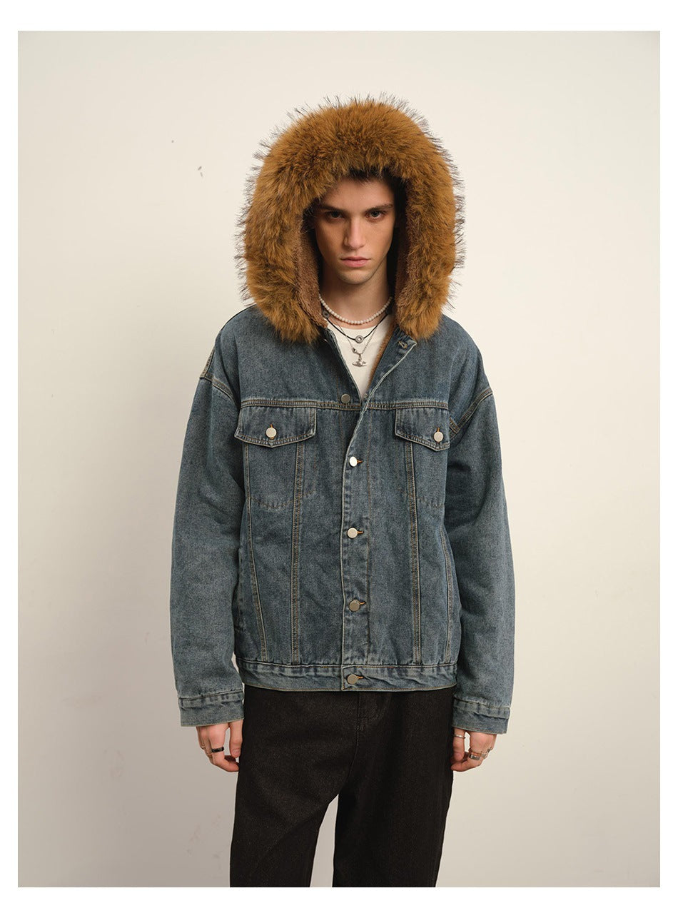 Front view of a man wearing a blue denim jacket with a large brown fur-trimmed hood and buttoned chest pockets.